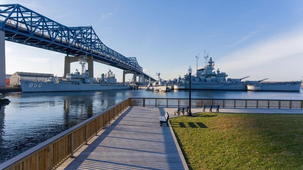Fall River waterfront boardwalk with Battleship Cove and the Braga Bridge over the Taunton River